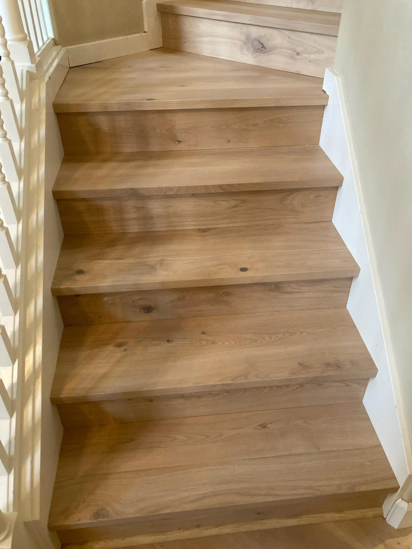 Custom white oak square stair nosings installed on a hardwood staircase in Bellevue, Washington.