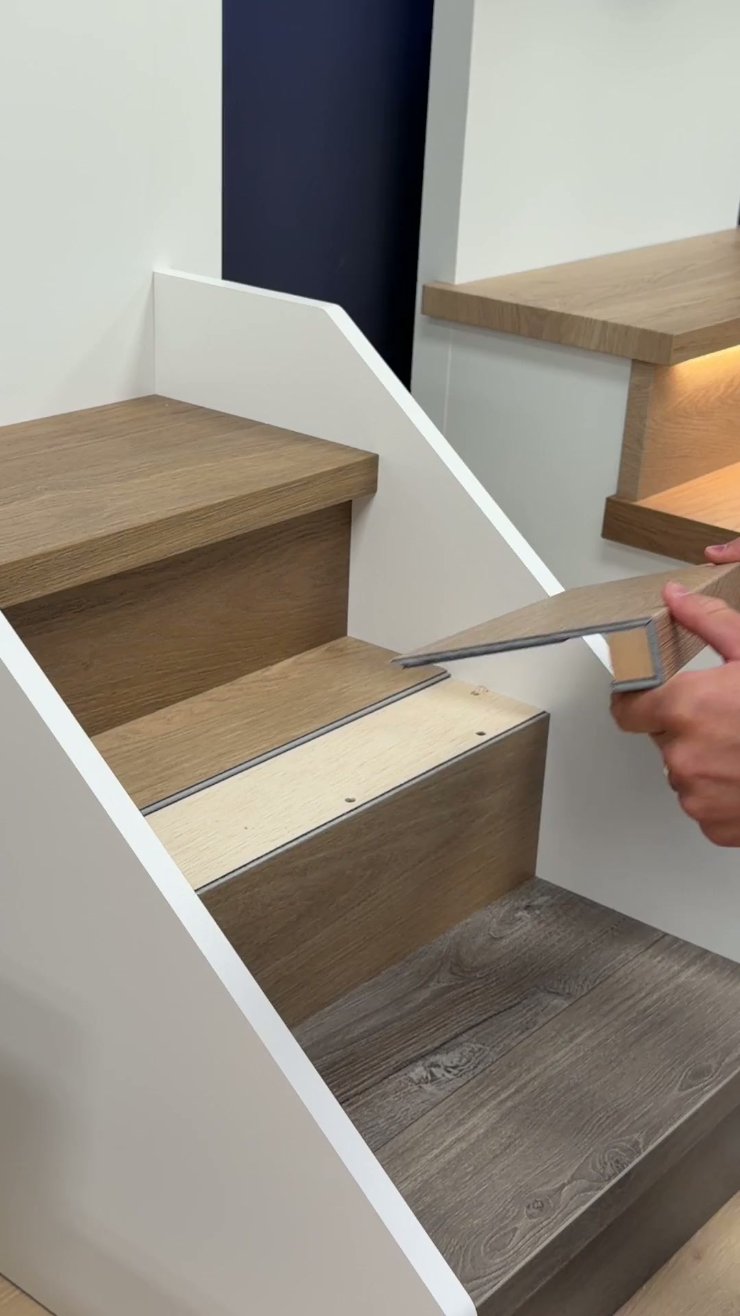 Looping shop clip showing a custom stair nosing profile and finish detail at the Voda Stairs shop in Tukwila, Washington.